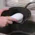 cleaning a dirty black dish with MutliBrush Pro